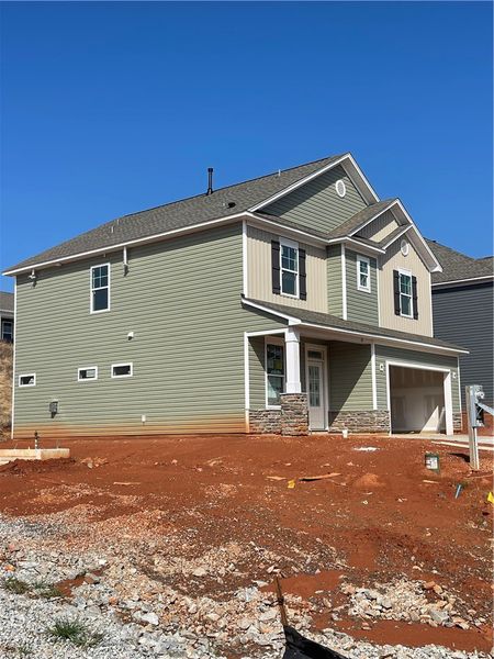 This newly constructed home features charming arch