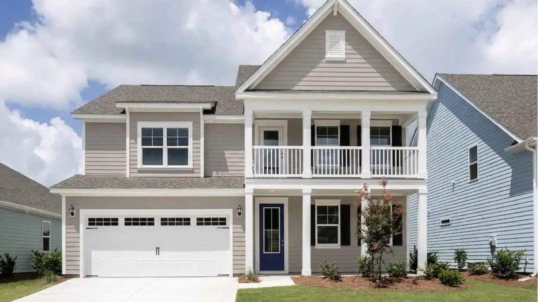 Front exterior of a new home in The Haven at Indigo Preserve, Leland, NC, highlighting curb appeal (Image 1). Front exterior of a new home in The Haven at Indigo Preserve, Leland, NC, highlighting curb appeal (Image 1).