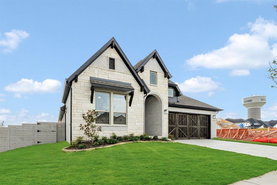 Front exterior of a new home in Painted Tree Woodland District 50, McKinney, TX, highlighting curb appeal (Image 25). Front exterior of a new home in Painted Tree Woodland District 50, McKinney, TX, highlighting curb appeal (Image 25).