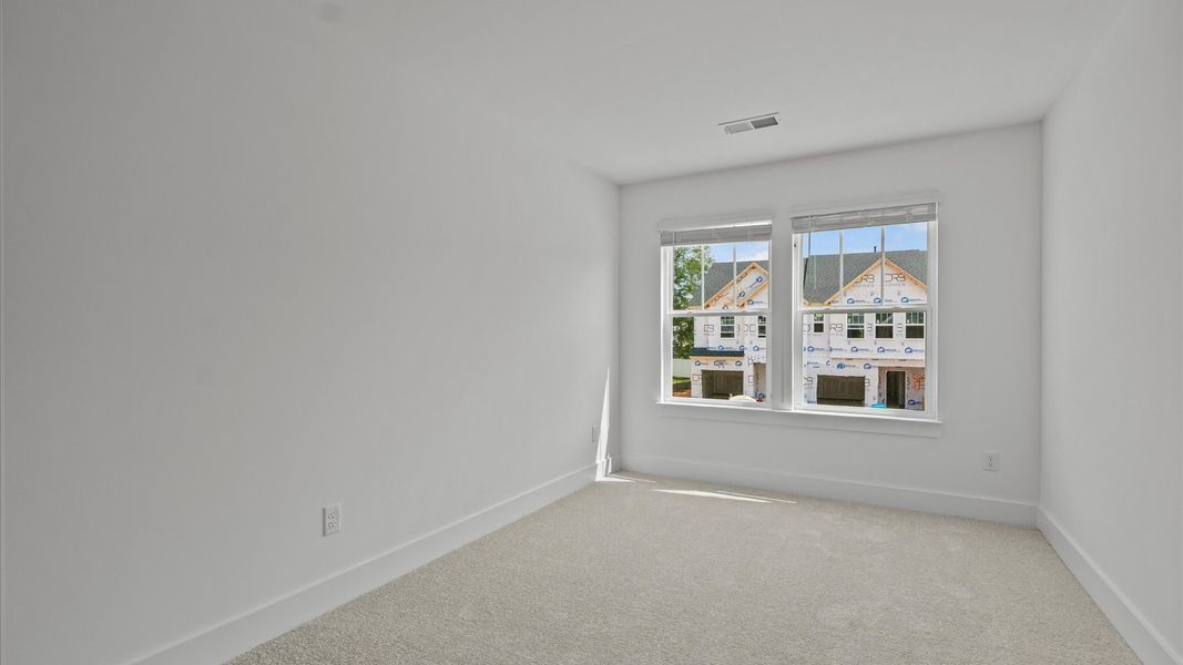 Refined bedroom design with large windows for daylight-filled mornings and peaceful views Refined bedroom design with large windows for daylight-filled mornings and peaceful views