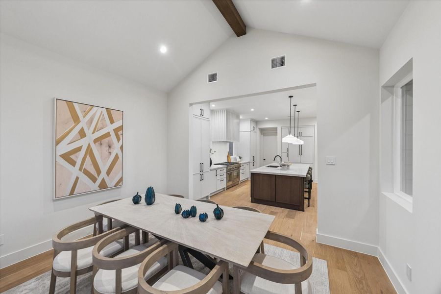 Spacious dining area bathed in natural light, perfectly positioned next to the kitchen for effortless hosting.