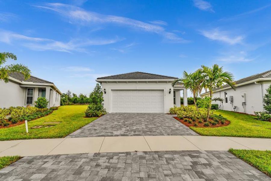 Front exterior of a new home in , Vero Beach, FL, highlighting curb appeal (Image 24). Front exterior of a new home in , Vero Beach, FL, highlighting curb appeal (Image 24).