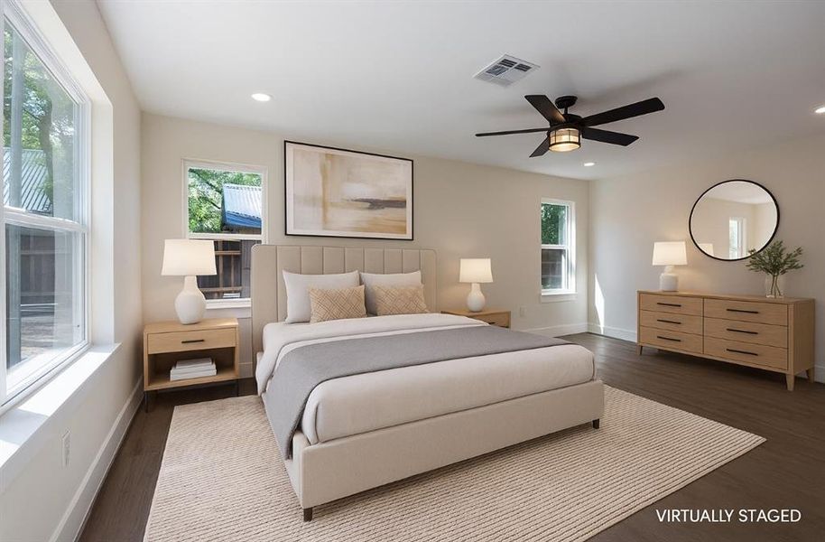 Bedroom with multiple windows, ceiling fan, dark wood-type flooring, and recessed lighting