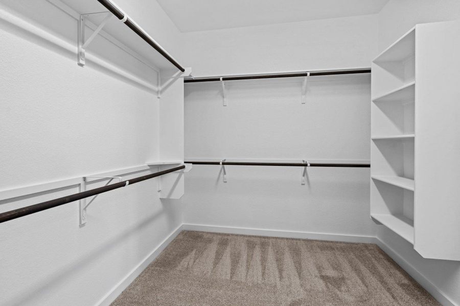 Walk-in closet in Primary Bedroom Walk-in closet in Primary Bedroom