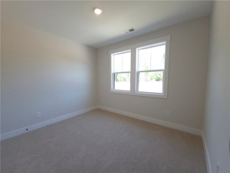 This bright and airy room offers a blank canvas fo