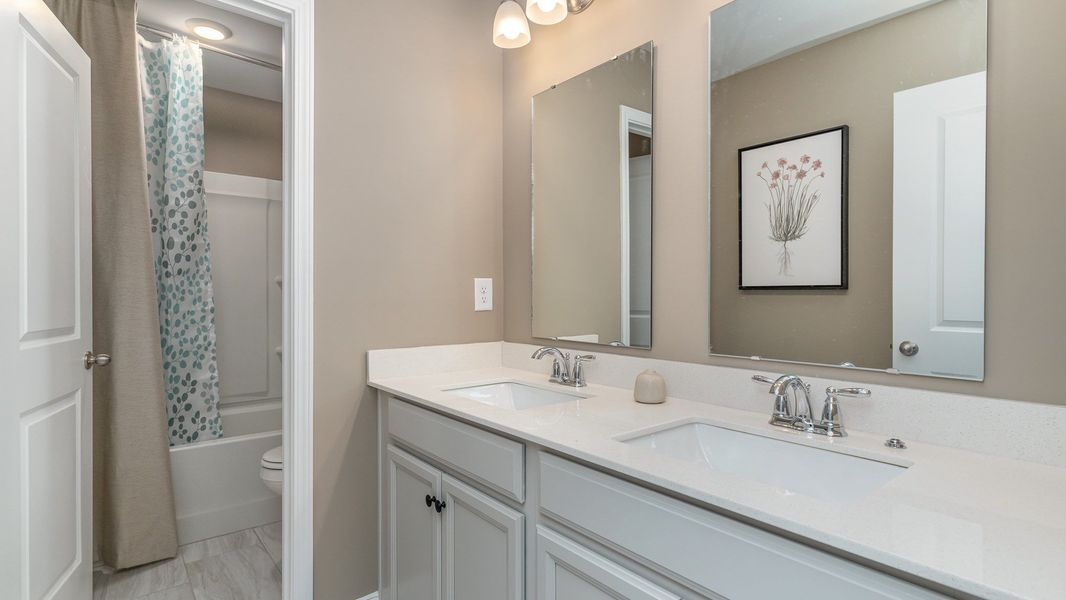 Representative furnished interior of a home built from the HARBOR OAK by D.R. Horton in Spring View Landing, Loris (Image 6).
