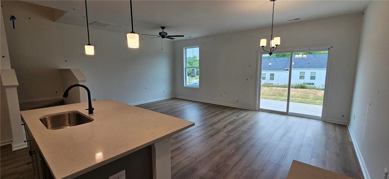 Bright, open concept living space features a kitch