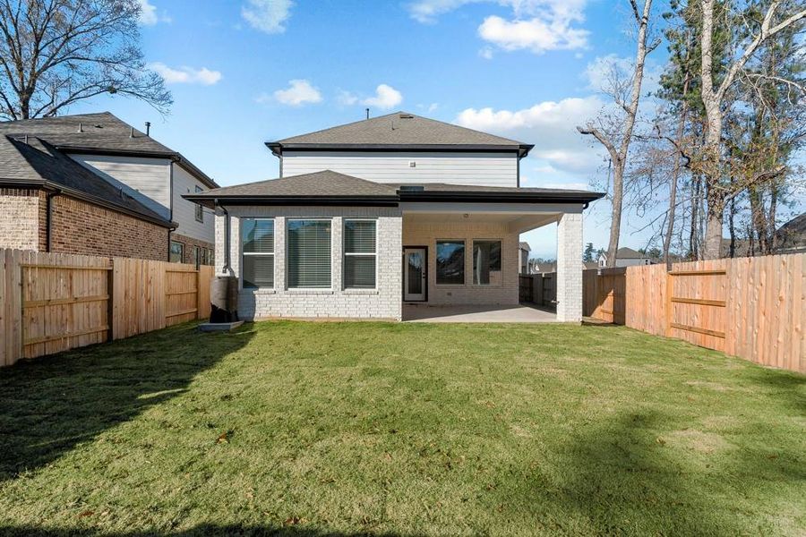Back Yard and Covered Porch   [Photo shown is from a completed home with the same floorplan and similardesign selections.]