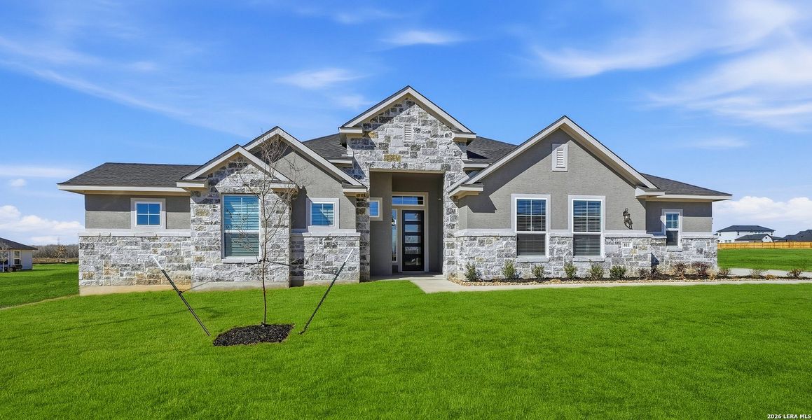 Front exterior of a new home in Sienna Lakes, San Antonio, TX, highlighting curb appeal (Image 22).