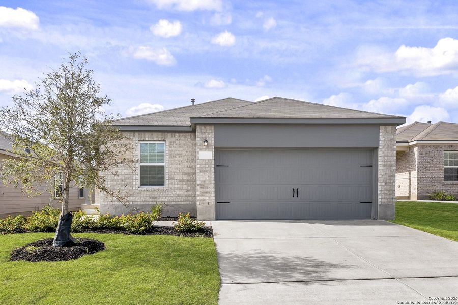 Front exterior of a new home in Preserve at Medina, Von Ormy, TX, highlighting curb appeal (Image 12).