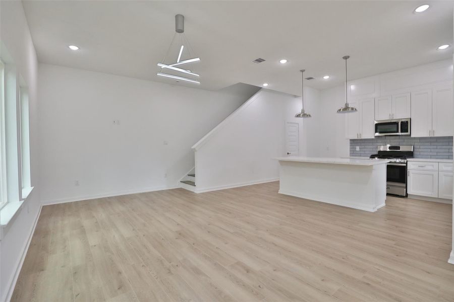 Experience the open and airy modern floor plan, perfect for versatile room configurations.