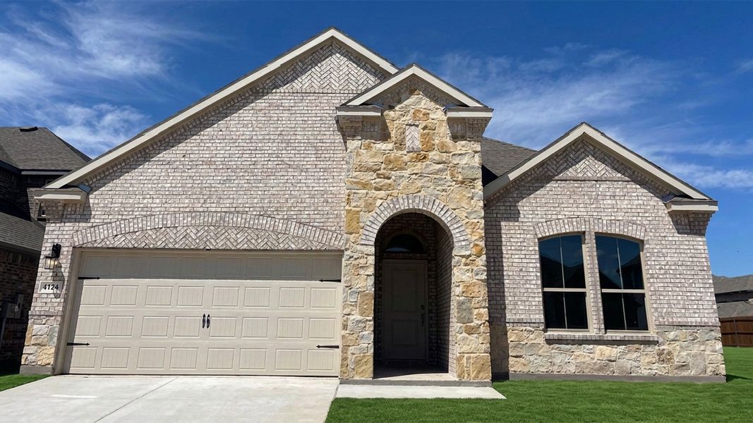Front exterior of a new home in Lakewood Trails, Forney, TX, highlighting curb appeal (Image 1). Front exterior of a new home in Lakewood Trails, Forney, TX, highlighting curb appeal (Image 1).