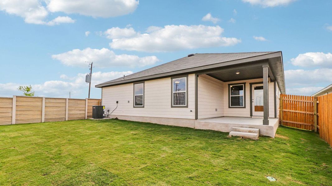 Exterior details and patio area of a home in Monarch Ranch, Manor (Image 20).