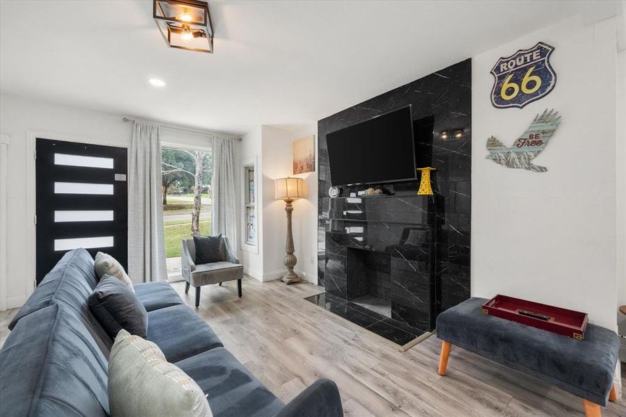 Living area with wood finished floors and recessed lighting Living area with wood finished floors and recessed lighting