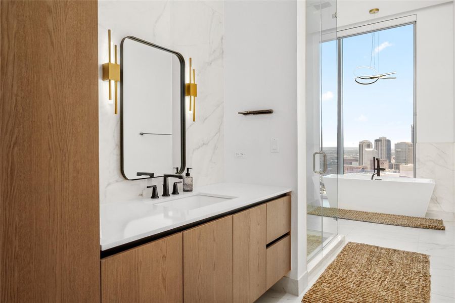 Primary retreat separate dedicated vanities, steam shower and soaking tub.