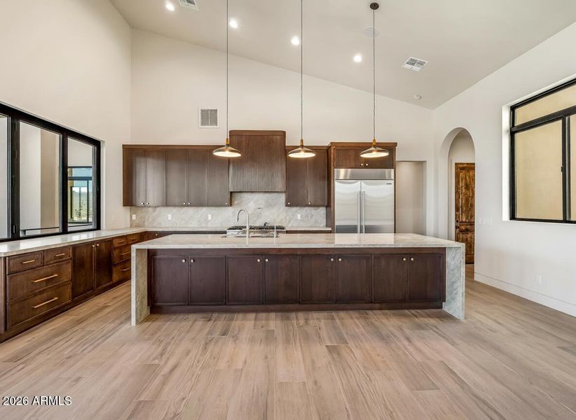 Kitchen with large quartzite island Kitchen with large quartzite island