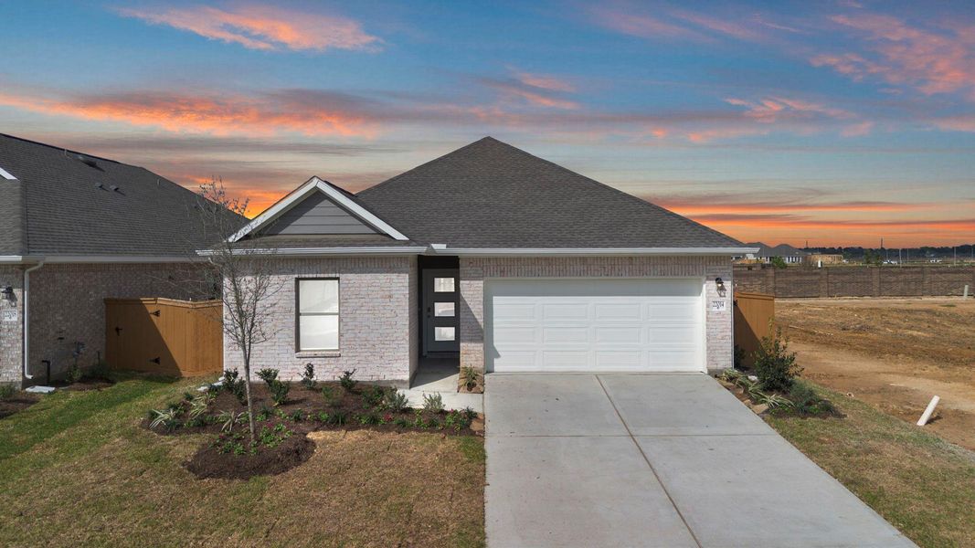 Front exterior of a new home in Cypress Green, Hockley, TX, highlighting curb appeal (Image 1). Front exterior of a new home in Cypress Green, Hockley, TX, highlighting curb appeal (Image 1).
