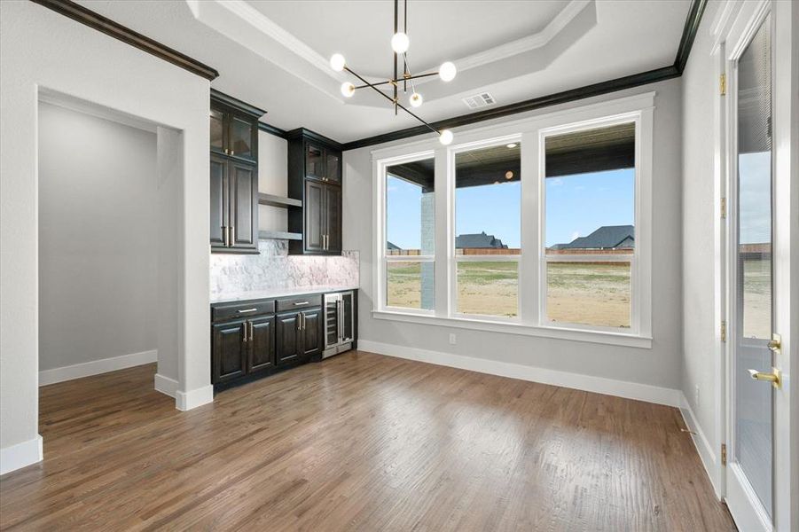 Dining are with built in cabinets and open shelving Dining are with built in cabinets and open shelving