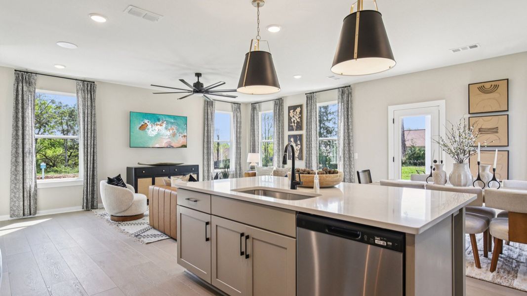 Kitchen island view of dining area and living room