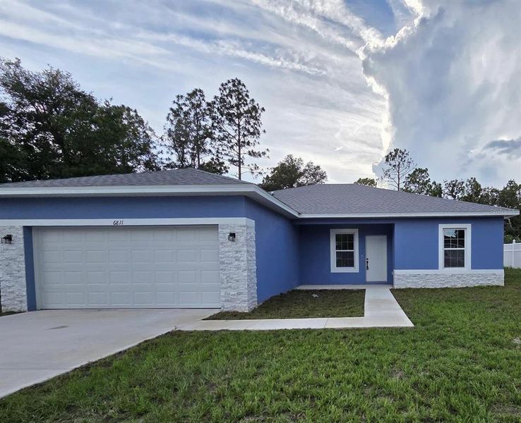 Front exterior of a new home in , Ocala, FL, highlighting curb appeal (Image 2). Front exterior of a new home in , Ocala, FL, highlighting curb appeal (Image 2).