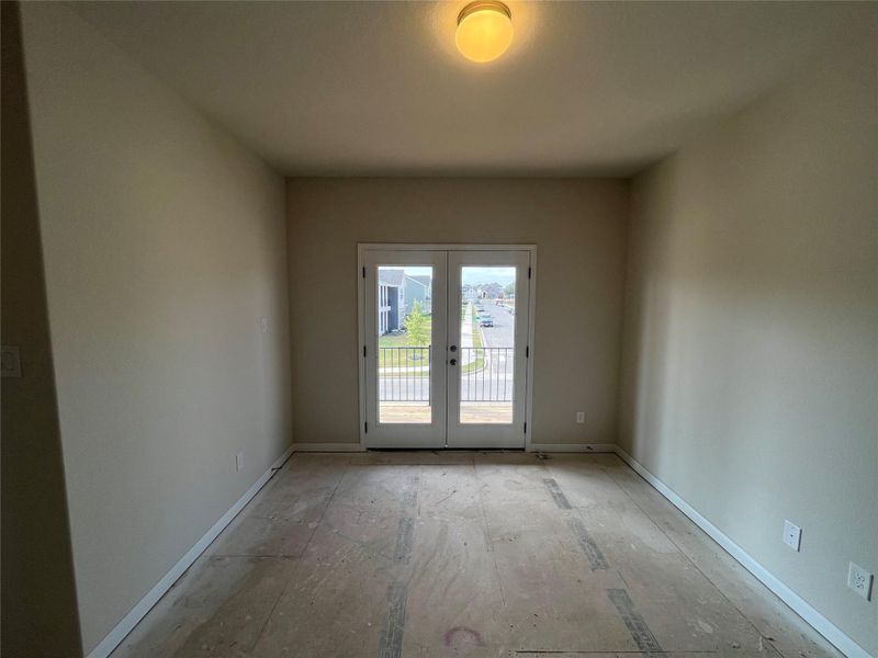 In-progress construction of a new home in The Cottages at Lariat, Liberty Hill, TX (Image 26).