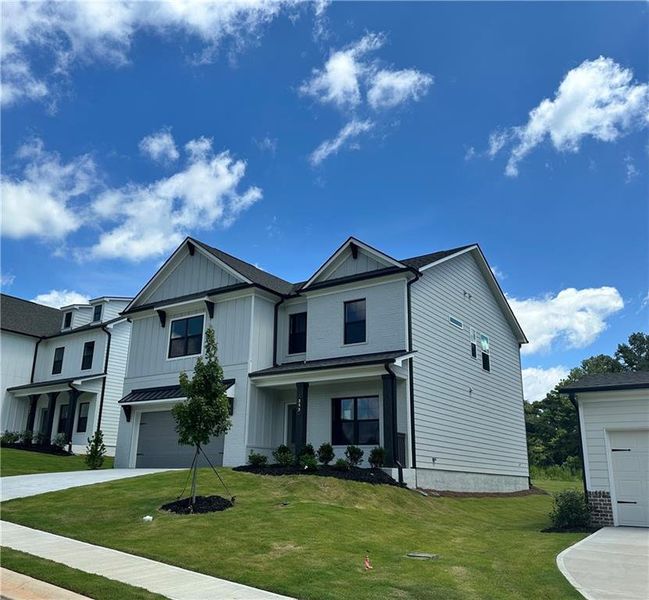 Front exterior of a new home in Summerlin, Winder, GA, highlighting curb appeal (Image 19).
