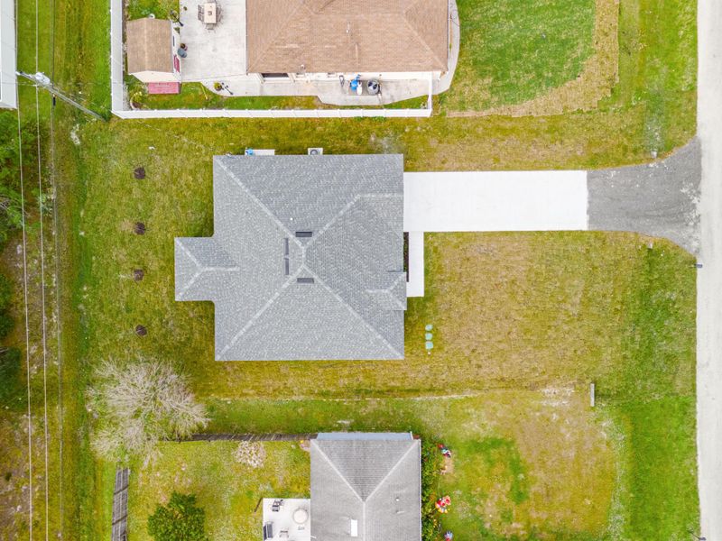 Front exterior of a new home in , Vero Beach, FL, highlighting curb appeal (Image 18).