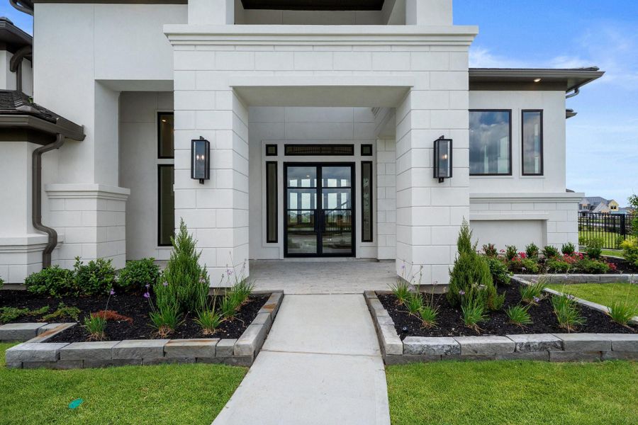 Front exterior of a new home in Bridgeland 45', 50', 70', Cypress, TX, highlighting curb appeal (Image 2). Front exterior of a new home in Bridgeland 45', 50', 70', Cypress, TX, highlighting curb appeal (Image 2).