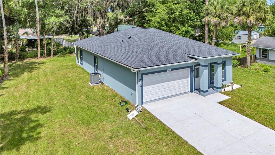 Front exterior of a new home in , Daytona Beach, FL, highlighting curb appeal (Image 16).