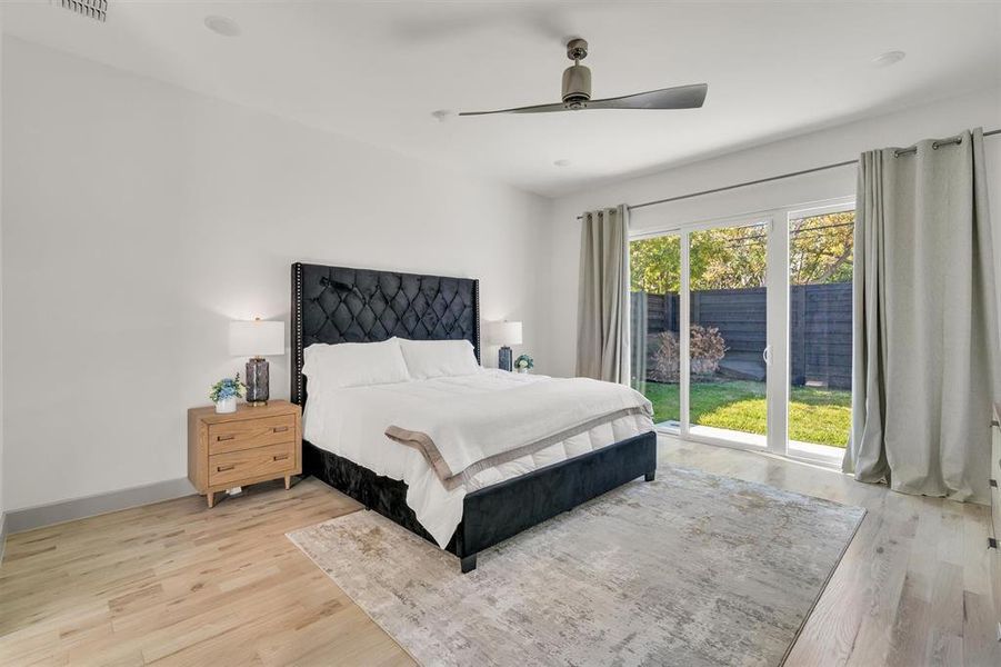 Bedroom with ceiling fan and light hardwood / wood-style flooring