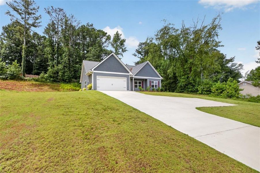 Front exterior of a new home in , Dallas, GA, highlighting curb appeal (Image 23). Front exterior of a new home in , Dallas, GA, highlighting curb appeal (Image 23).