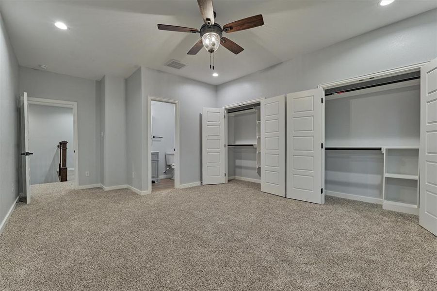 This guest room features two closets and an ensuite bath.