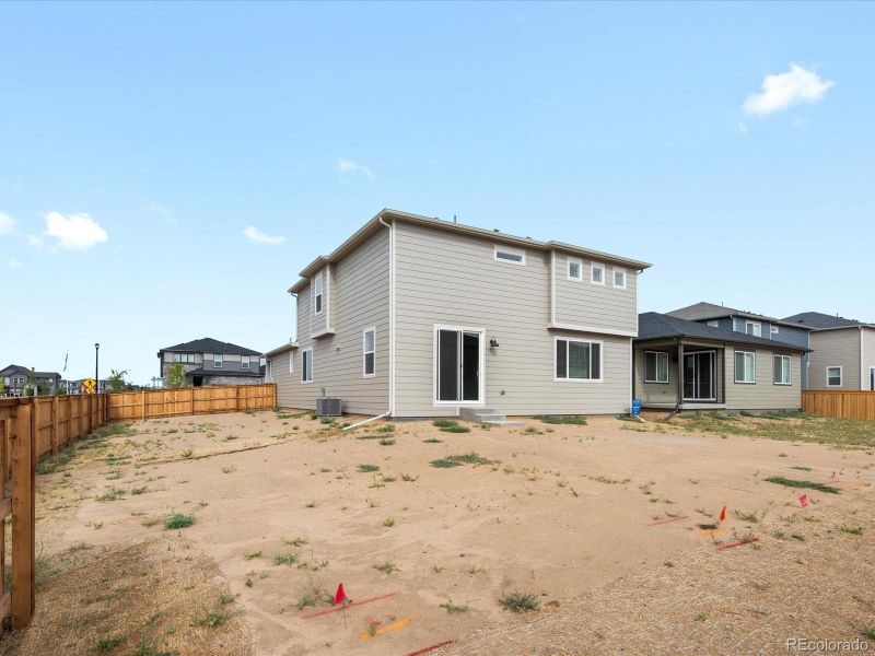 Front exterior of a new home in Ridgeline Vista: The Flora Collection, Brighton, CO, highlighting curb appeal (Image 1). Front exterior of a new home in Ridgeline Vista: The Flora Collection, Brighton, CO, highlighting curb appeal (Image 1).