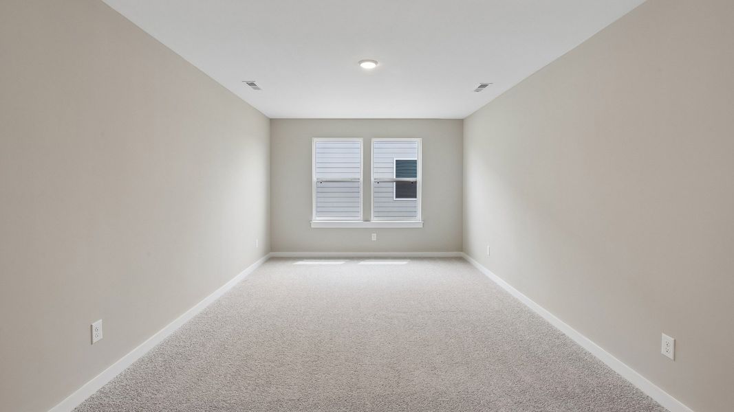 Second Floor Loft area with windows and carpet