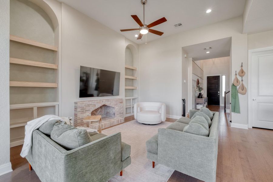 The brick hearth gives the living room an unexpected focal point with plenty of character.