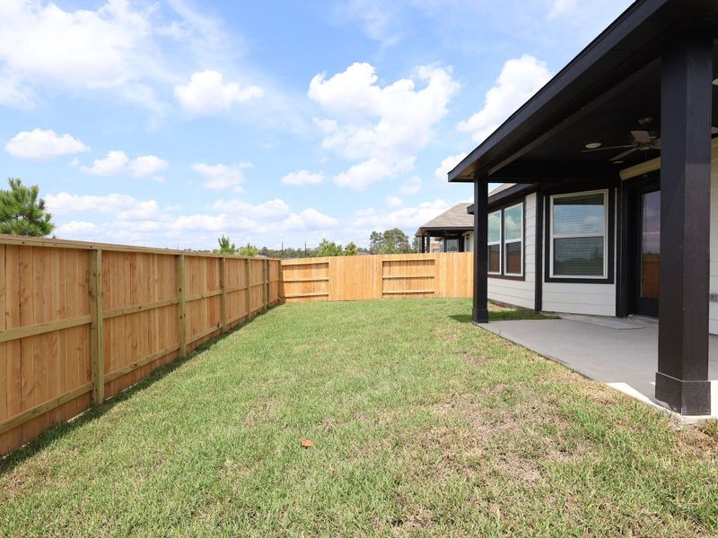 Front exterior of a new home in Magnolia Ridge, Magnolia, TX, highlighting curb appeal (Image 15). Front exterior of a new home in Magnolia Ridge, Magnolia, TX, highlighting curb appeal (Image 15).