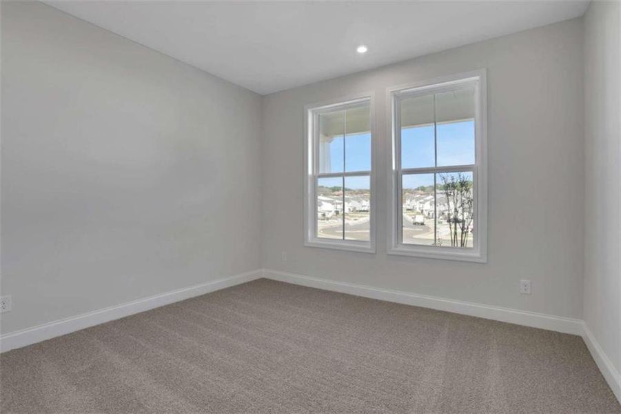 Spacious, unfurnished interior of a new home in The Paddocks at Doc Hughes, Buford (Image 35).