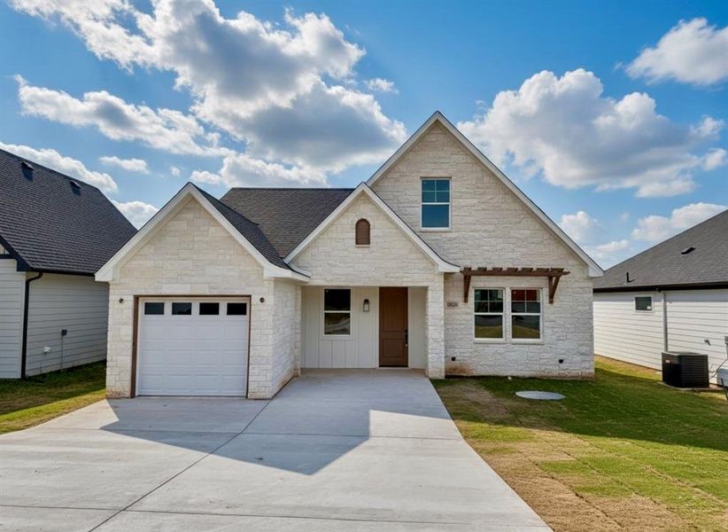 Front exterior of a new home in , Granbury, TX, highlighting curb appeal (Image 2). Front exterior of a new home in , Granbury, TX, highlighting curb appeal (Image 2).