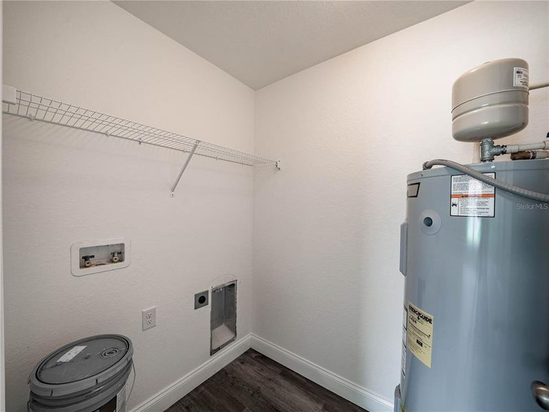 Laundry room. Photos of a completed model. Actual finishes of this home home may not be the same as portrayed in these photos.