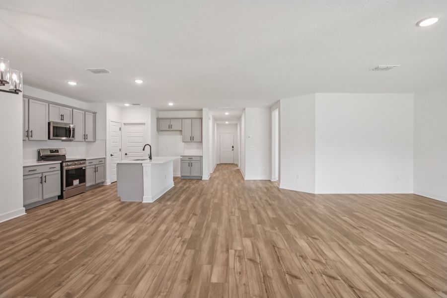 Experience elegance with sleek gray cabinetry and exquisite wood flooring at Deering II, Spring Hill.