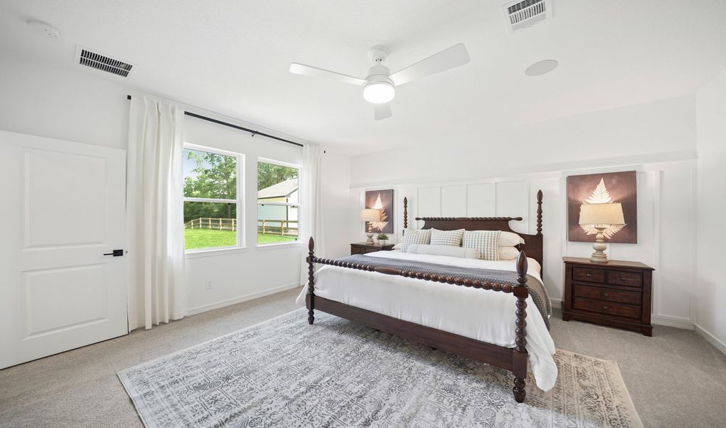 Primary suite with decorative feature wall Primary suite with decorative feature wall