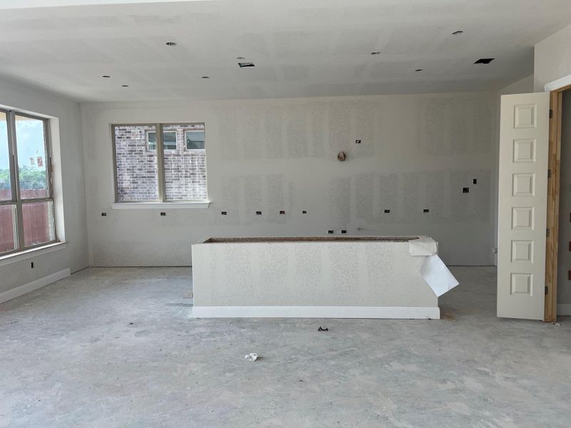 Spare room with unfinished concrete flooring Spare room with unfinished concrete flooring