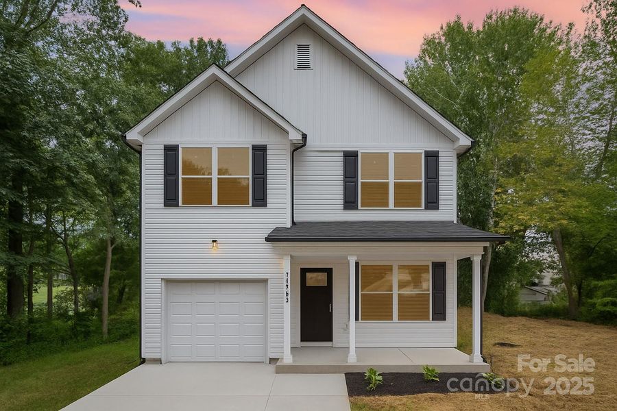 Front exterior of a new home in , Hickory, NC, highlighting curb appeal (Image 1).