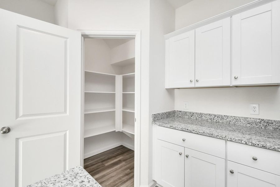 Furnished interior view inside a new home in Sunterra, Katy (Image 9).