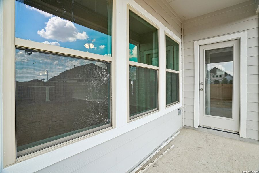 Exterior details and patio area of a home in Prairie Green, Converse (Image 4).