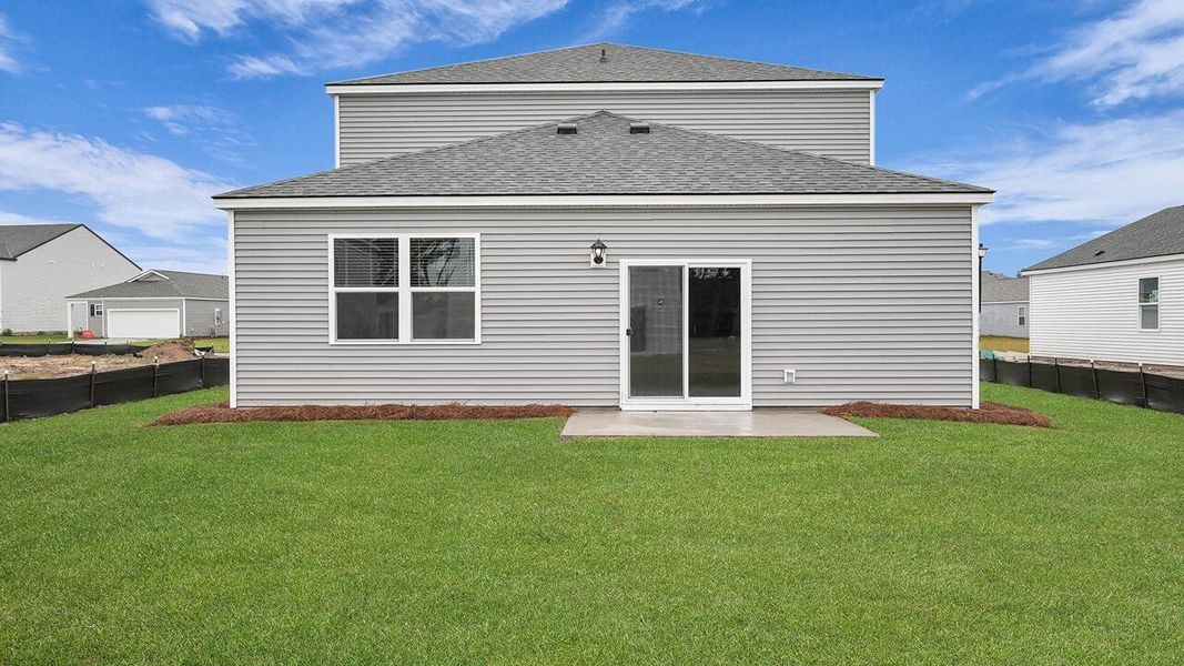 Exterior details and patio area of a home in Pine Hills at Cane Bay, Summerville (Image 21).