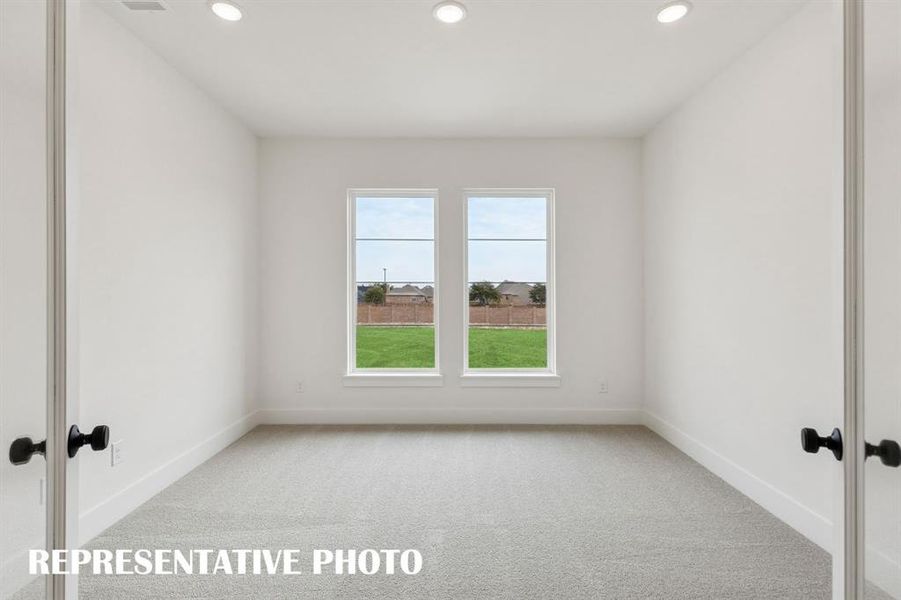 The professional working from home will appreciate this private, light filled home office.  REPRESENTATIVE PHOTO