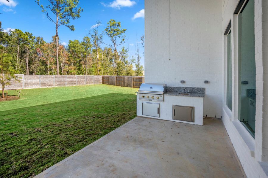 Exterior details and patio area of a home in ARTAVIA 55' Lots, Conroe (Image 28). Exterior details and patio area of a home in ARTAVIA 55' Lots, Conroe (Image 28).