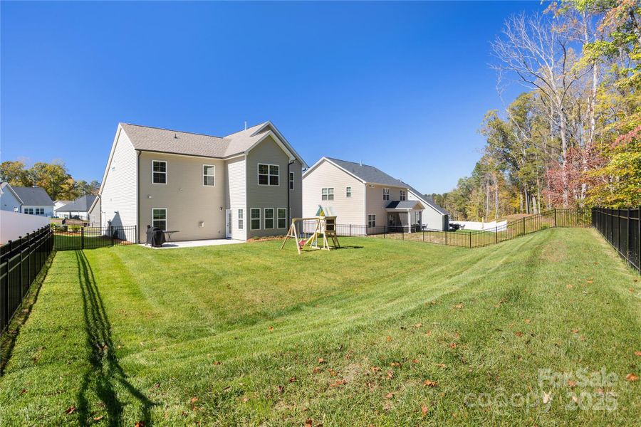 Fully fenced backyard with full irrigation. Fully fenced backyard with full irrigation.