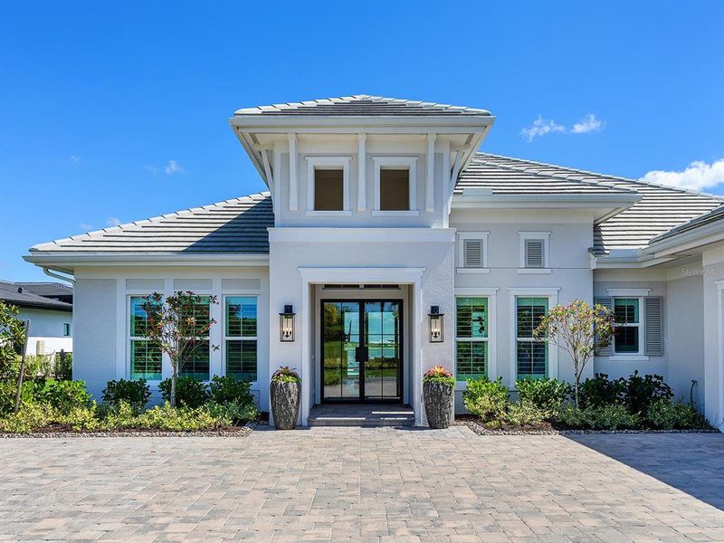 Front exterior of a new home in , Sarasota, FL, highlighting curb appeal (Image 26).